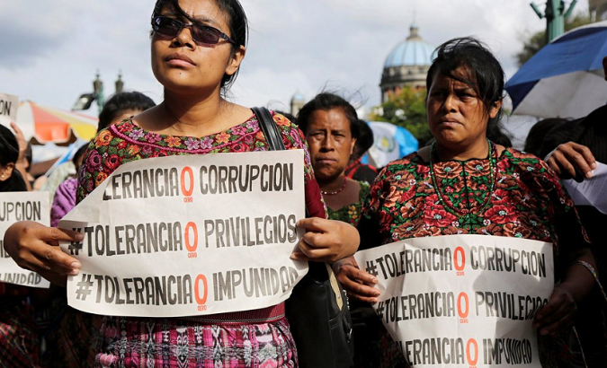 A group of women protest against the government of Jimmy Morales infront of the national palace in Guatemala City.