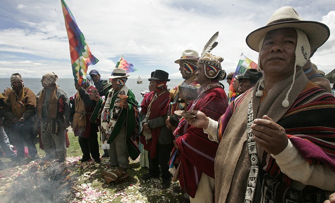 Aymara people perform ritual at lake Titicaca.