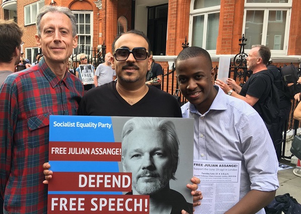 Human rights campaigner Peter Tatchell (L) with demonstrators outside London's Ecuadorean Embassy.