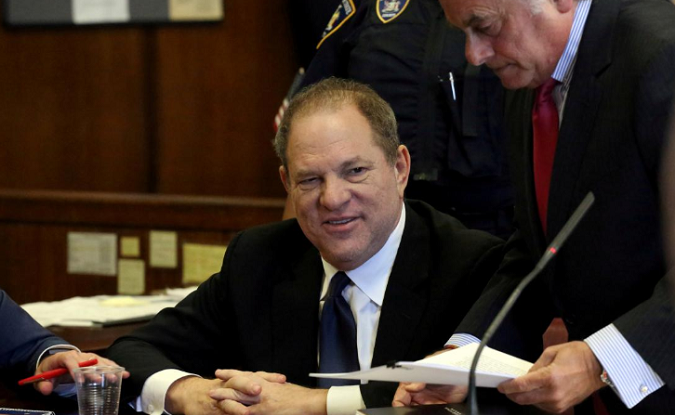 Film producer Harvey Weinstein speaks to his lawyer Benjamin Brafman inside Manhattan Criminal Court during an arraignment in the Manhattan borough of New York, U.S., July 9, 2018.