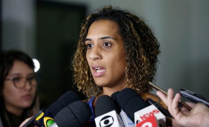 Anielle da Silva, the younger sister of slain Black activist Marielle Franco, speaks to the press.