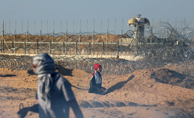 Palestinians in Gaza take part in Friday's protests near the Israeli fence demanding their right to return as refugees.