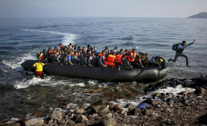 A boat with migrants arriving at the Greek island of Lesbos.