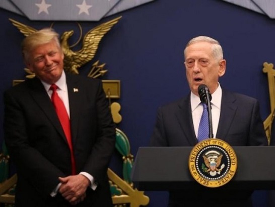 U.S. President Donald Trump listens to remarks by Defense Secretary James Mattis (R) after a swearing-in ceremony for Mattis at the Pentagon in Washington, US.