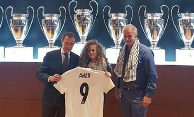 Ahed Tamimi being presented with a Real Madrid jersey in Spain.