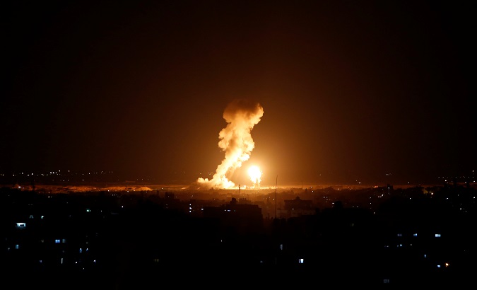 Smoke and flame are seen during an Israeli air strike in Gaza, Nov. 12, 2018.