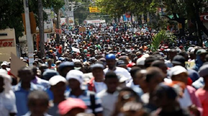 Thousands of Haitians protest in the streets against corruption.