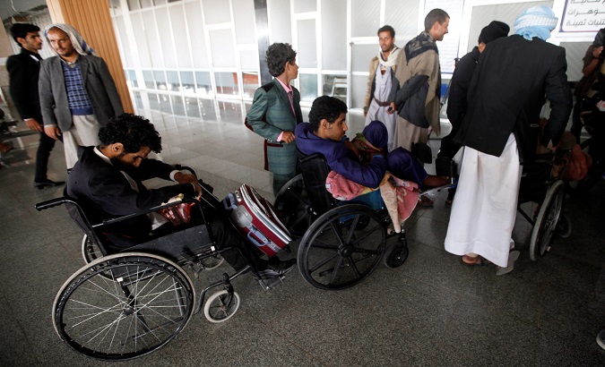 Wounded Houthi fighters wait at Sanaa airport during their evacuation from Yemen, Dec. 3, 2018.