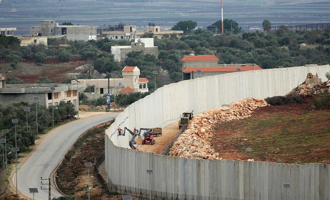 Israeli forces continue construction on a wall on the Israeli - Southern Lebanon border.