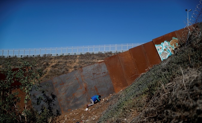 A migrant looks to cross to the U.S. from Tijuana, Mexico on Dec. 7, 2018.