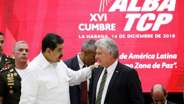 Venezuela's President Nicolas Maduro (L) talks to Cuba's President Miguel Diaz-Canel during the 16th Bolivarian Alliance for the Peoples of Our America-Peoples Trade Agreement (ALBA-TCP) Summit in Havana, Cuba, Dec. 14, 2018.