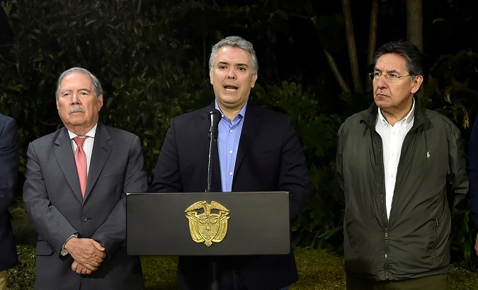 Colombian President Ivan Duque speaks at a news conference, along with Defense Minister Guillermo Botero and National Prosecutor Nestor Humberto Martinez, in Medellin.