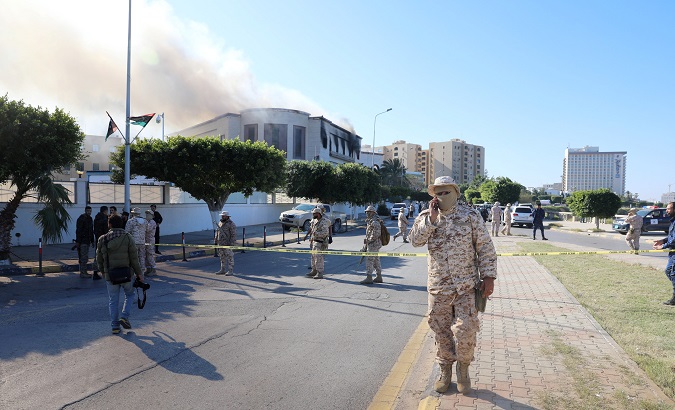 Security forces stand at the site of the headquarters of Libya's foreign ministry after suicide attackers hit in Tripoli, Libya December 25, 2018.