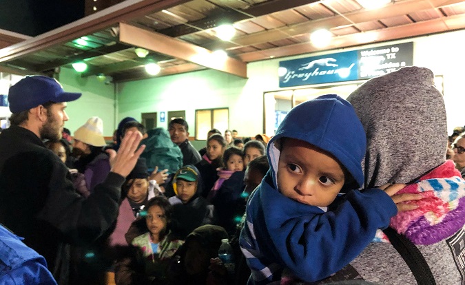 Some of over 200 migrants dropped off at a bus station by U.S. Immigration and Customs Enforcement (ICE), wait for transportation to shelters in El Paso, Texas, U.S. December 23, 2018.