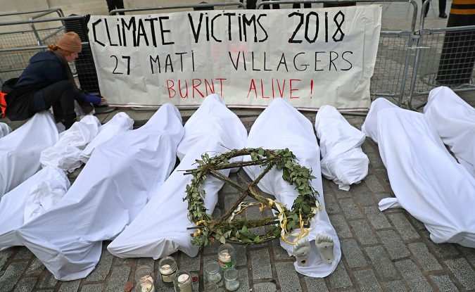 Protesters from the climate change pressure group Extinction Rebellion demonstrate outside the BBC offices in central London, Britain, December 21, 2018.