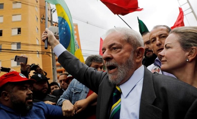 Former Brazilian President Luiz Inacio Lula da Silva arrives at Federal Justice, with senator Gleisi Hoffmann (R) for a testimony in Curitiba, Brazil, May 10, 2017.
