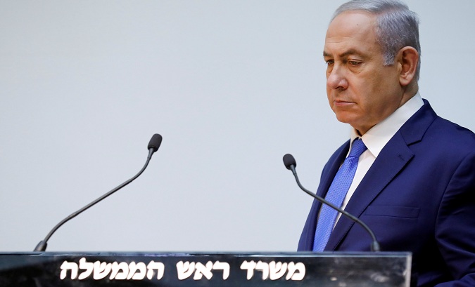 Israeli Prime Minister Benjamin Netanyahu delivers a statement at the Knesset, Israel's parliament, in Jerusalem Dec. 19, 2018.