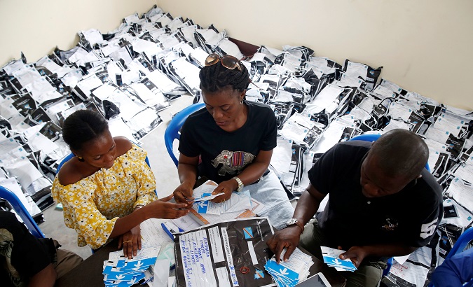 Electoral officials count ballots at tallying centre in Kinshasa, DR Congo, Jan. 4, 2019.