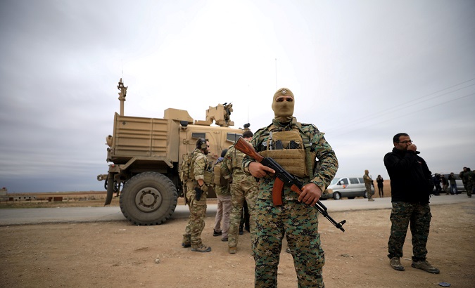 Syrian Democratic Forces and U.S. troops are seen during a patrol near Turkish border in Hasakah, Syria Nov. 4, 2018