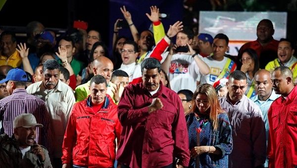 Venezuela's President Nicolas Maduro stands with supporters during a gathering after the results of the election were released, outside of the Miraflores Palace in Caracas, Venezuela, May 20, 2018. 