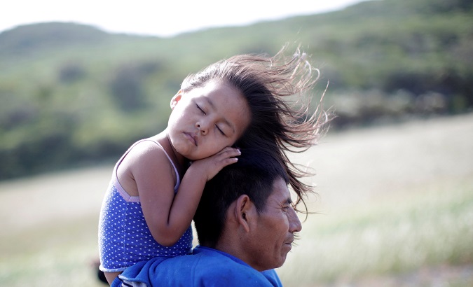 Rosendo Noviega, a 38-year-old migrant from Guatemala, part of a caravan of thousands from Central America en route to the United States, holds his daughter Belinda Izabel.