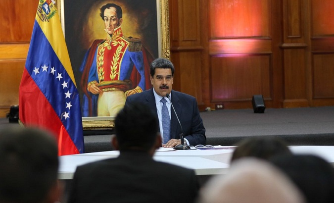 President Nicolas Maduro delivers a press conference to local and international media at the government's seat in Caracas.