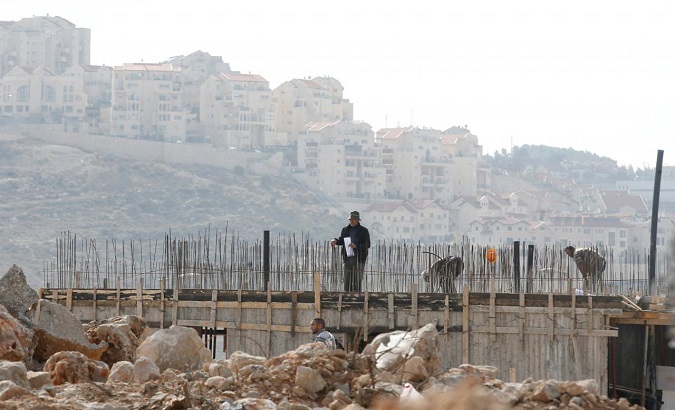 Palestinian labourers work at a construction site in the Israeli settlement of Efrat, in the occupied West Bank, December 29, 2016.