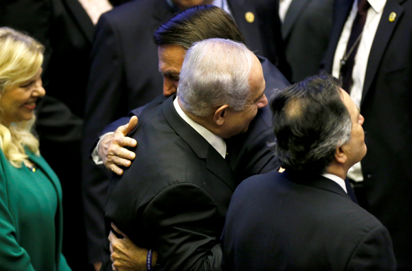 Brazilian President Jair Bolsonaro and Israeli Prime Minister Benjamin Netanyahu embrace at Bolsonaro's inauguration.