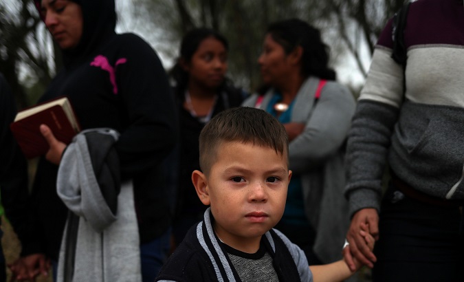 A seven-year-old Honduran migrant holds his mother's hand in Penitas, Texas, U.S., January 9, 2019.