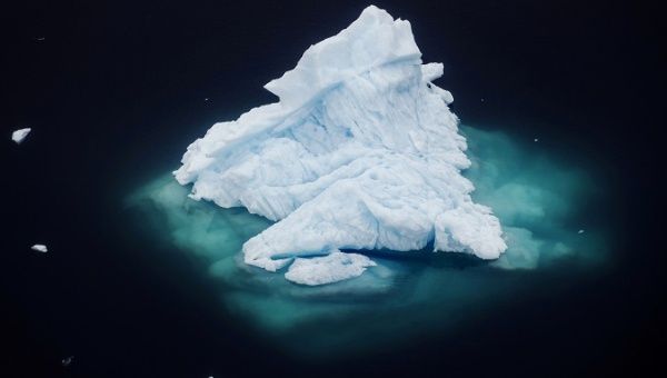An iceberg floats in a fjord near the town of Tasiilaq, Greenland, Jun. 24, 2018.