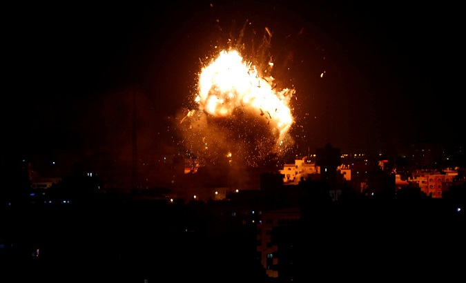 An explosion is seen during an Israeli air strike on Hamas's television station, in Gaza City, November 12, 2018.