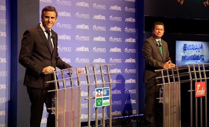 Right-wing candidate Carlos Calleja (L) and candidate for the FMLN, Hugo Martínez (R), participating in the televised debate in San Salvador.