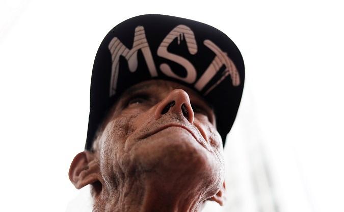 A man wears a cap with the initials of Brazil's Homeless Workers' Movement (MST) during a protest against Brazil's President Michel Temer's proposal to reform Brazil's social security system, in Sao Paulo, Brazil, December 5, 2017.