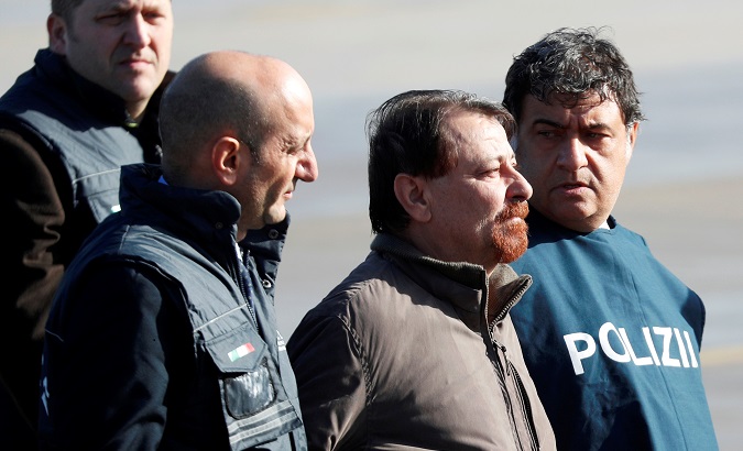 Former Italian leftist guerrilla Cesare Battisti arrives at Ciampino airport in Rome, Italy, Jan. 14, 2019.