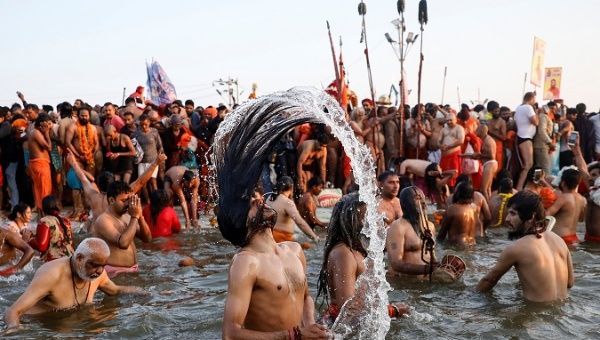 Naga Sadhus or Hindu holy men take dip during first 
