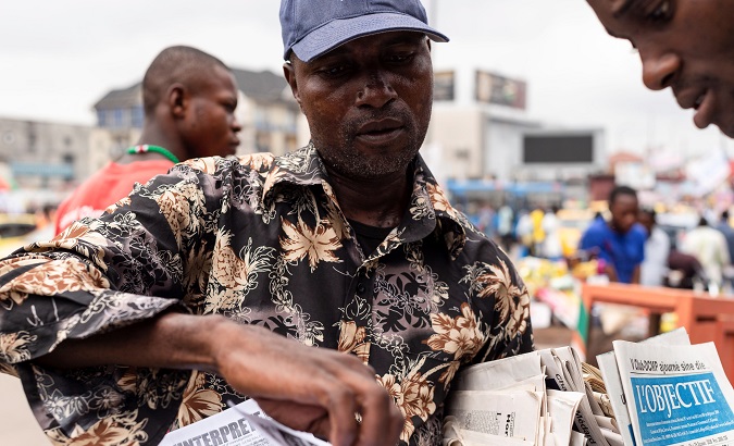 Citizens look at electoral information in Kinshasa, Democratic Republic of the Congo, Dec. 19, 2018.