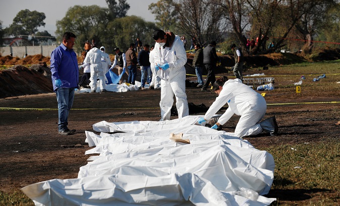 Forensic technicians tag bodies at the site where a fuel pipeline exploded, in the municipality of Tlahuelilpan, state of Hidalgo, Mexico Jan. 19, 2019.