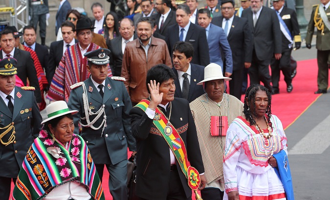 Bolivia's President Evo Morales waves during a ceremony that marks his 13 years in office at the former presidential palace in La Paz, Bolivia Jan. 22, 2019.