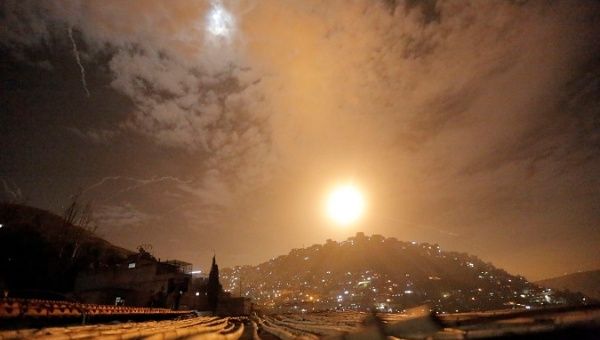 Syrian air defenses intercept Israeli missiles targeting an area in Damascus, Syria.