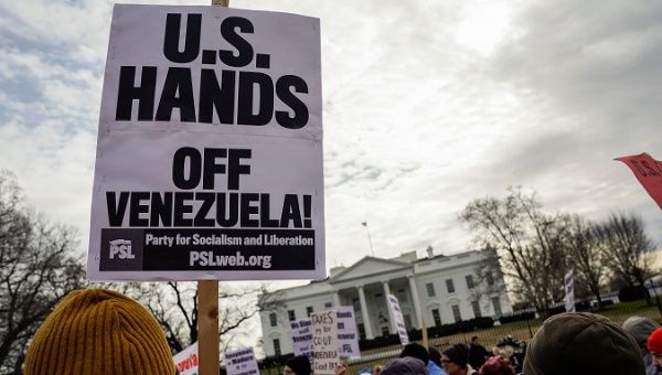 Anti-war and civil rights activists rally against Trump administration interference in Venezuela politics in front of the White House in Washington, U.S., January 26, 2019. 