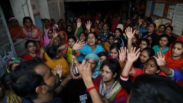 The garment workers shout as they protest for higher wages in Dhaka, Bangladesh Jan. 12, 2019.