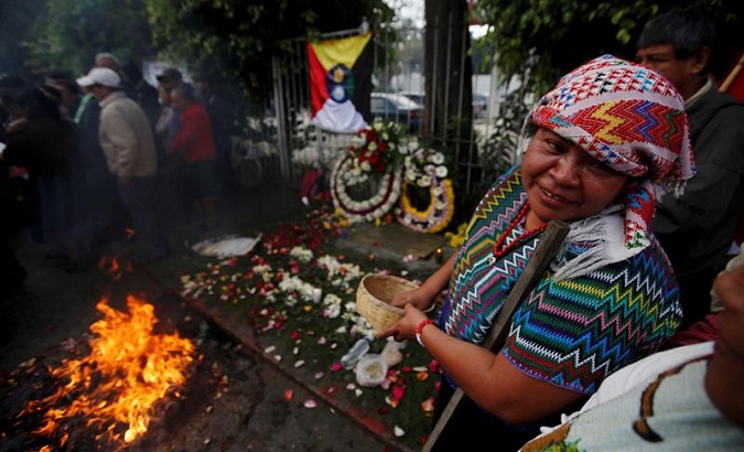 A Mayan spiritual guide takes part in a ceremony at the embassy building where 37 protesters were burned alive by security forces. Guatemala City. Jan. 31, 2019.