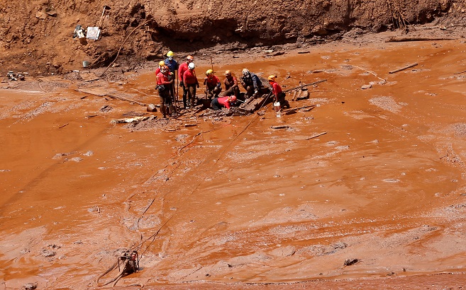 Rescue workers search for victims of a collapsed tailings dam owned by Brazilian mining company Vale SA, in Brumadinho, Brazil Feb. 2, 2019.