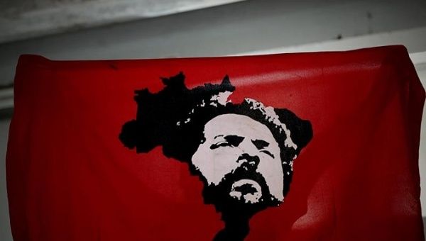Lula da Silva on a flag held by a supporter