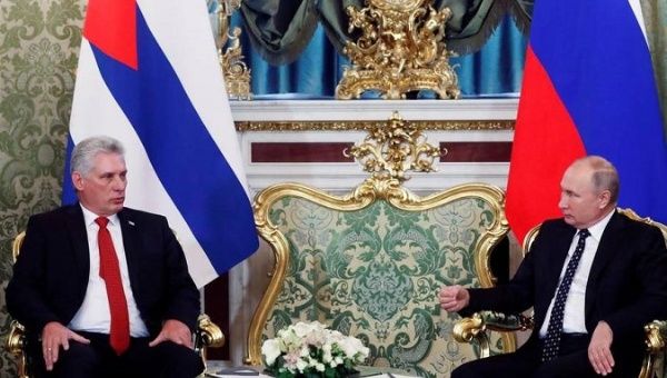 Cuban President Miguel Diaz-Canel (L) sits with his Russian counterpart, Vladimir Putin.