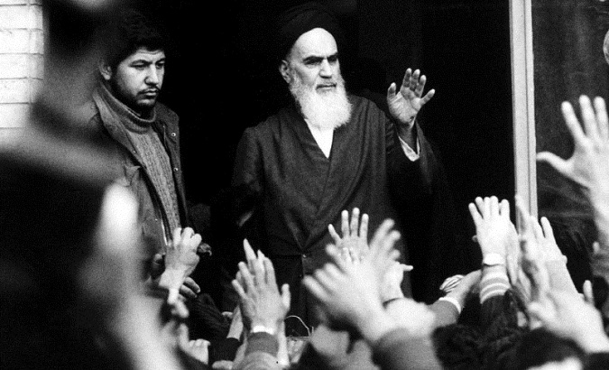 The late leader and founder of the Islamic revolution Ayatollah Khomeini speaks from a balcony of the Alavi school in Tehran, Iran, during the country's revolution in February 1979.