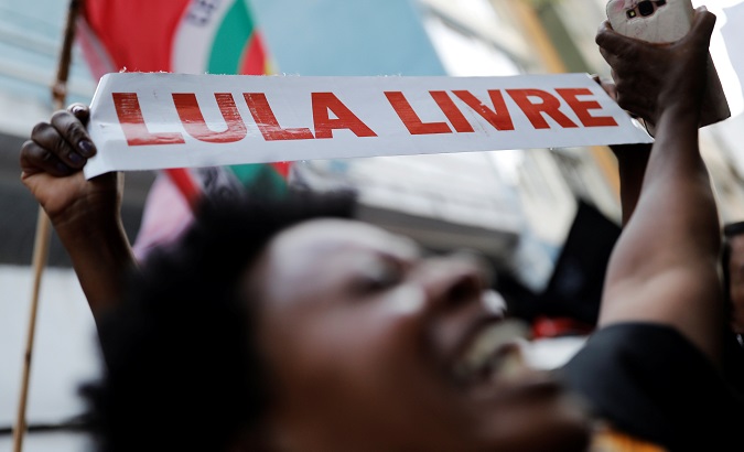 A Brazilian displays a sign reading Free Lula in Sao Paulo, Brazil, Feb.7, 2019.