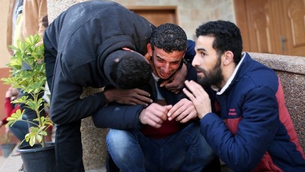 A relative of Palestinian teen Hassan Shalabi reacts as his body is brought into a hospital in the southern Gaza Strip Feb. 8, 2019. 