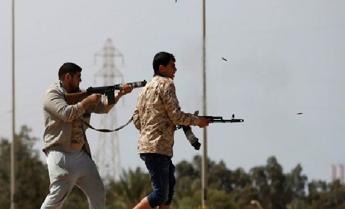 Fighters from Misrata fire weapons at Islamic State militants near Sirte March 15, 2015.
