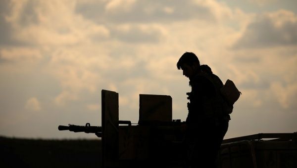 A member of Syrian Democratic Forces (SDF) stands on a pick up truck mounted with a weapon near Baghouz, Deir Al Zor province, Syria February 11, 2019.
